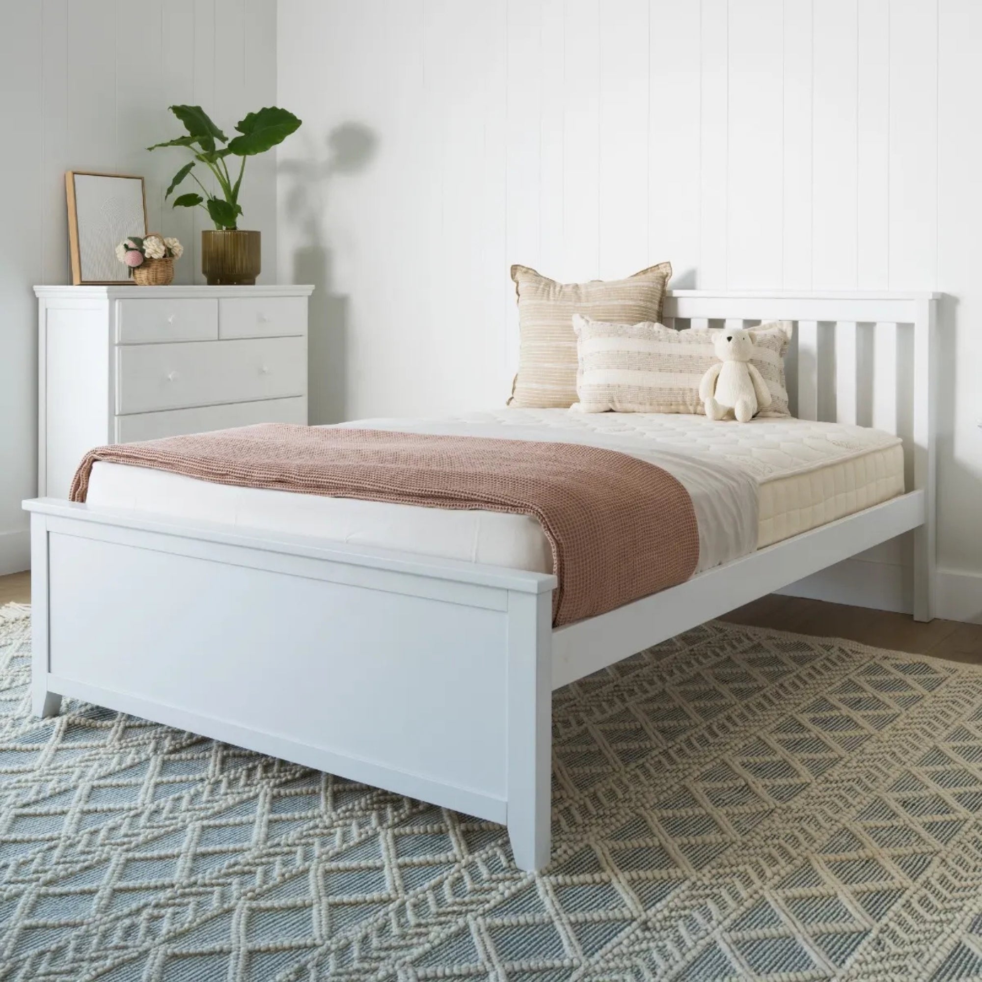 White bedroom with a bed, dresser, and decorative items. #size_Full Platform #color_washed white