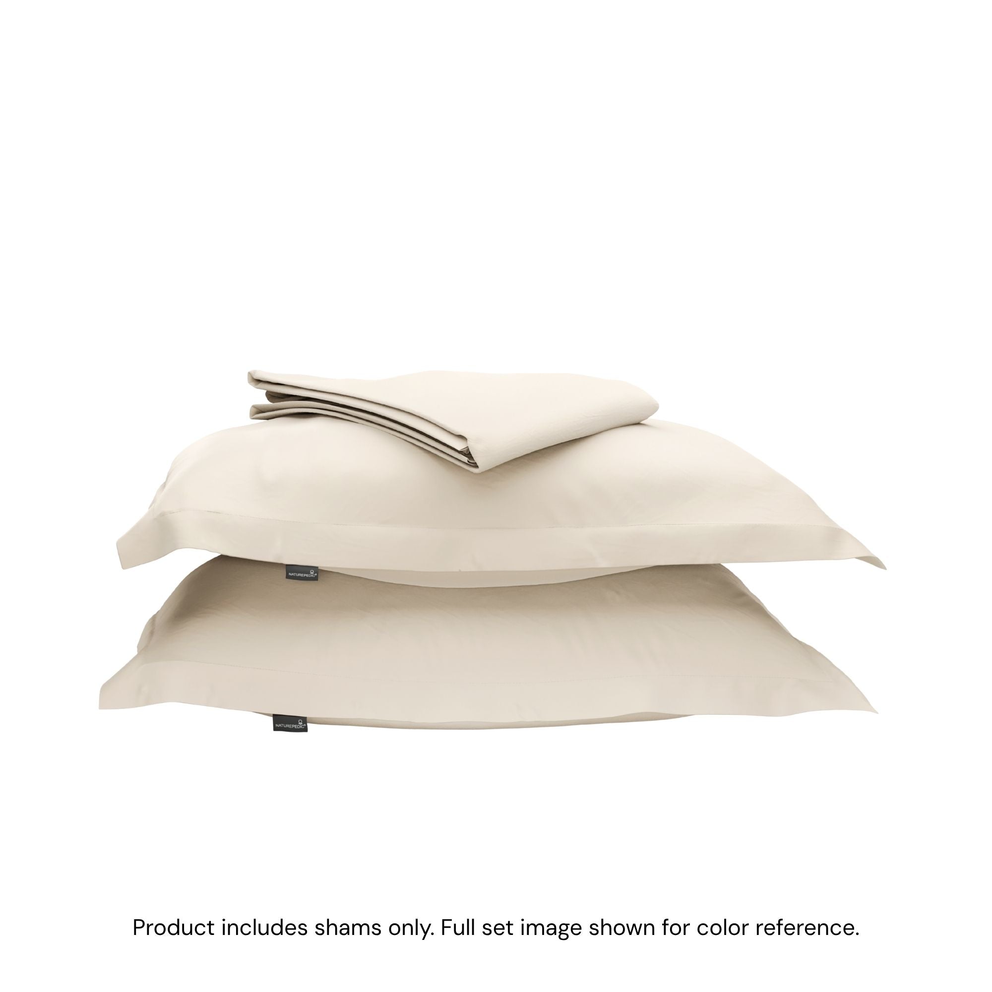 A duvet cover folded on top of two pillow shams #color_undyed