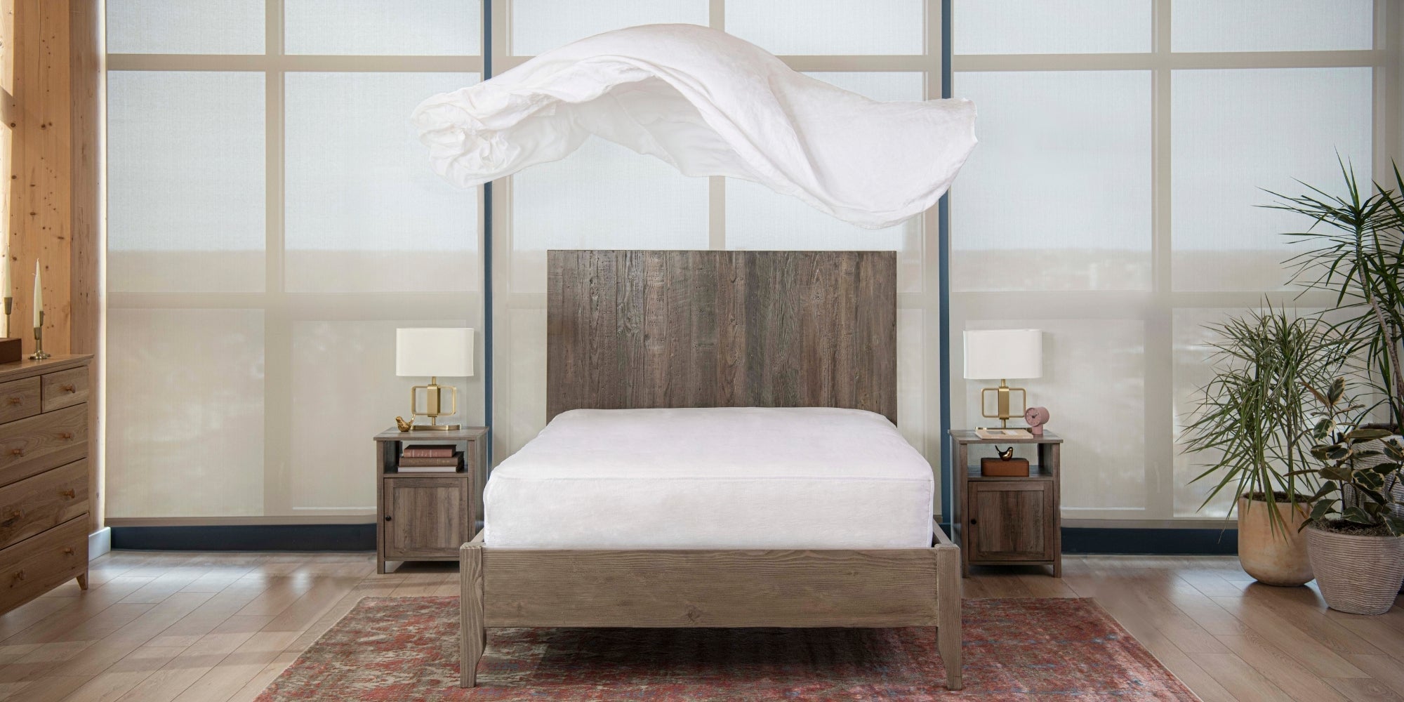 linen bedsheet floating above bed