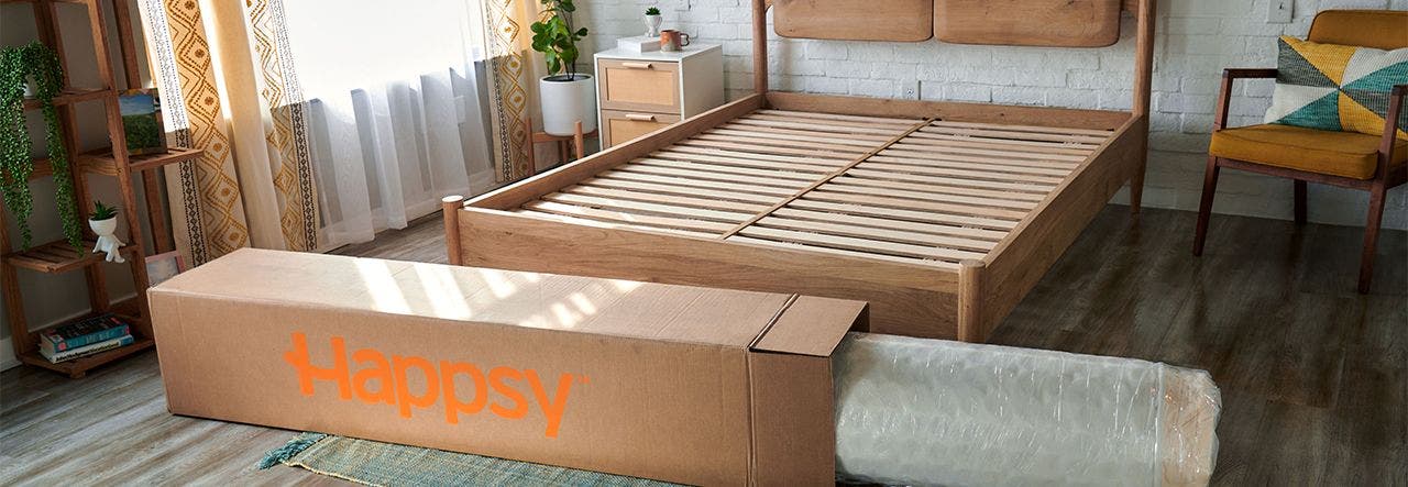 Happsy mattress foundation assembled with a Happsy mattress box nearby