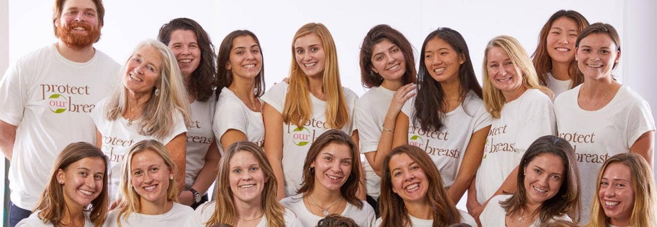 Group image of students and faclulty member wearing Protect Our Breasts t-shirts