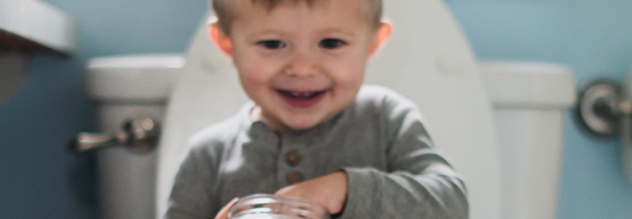 Child sitting on toilet