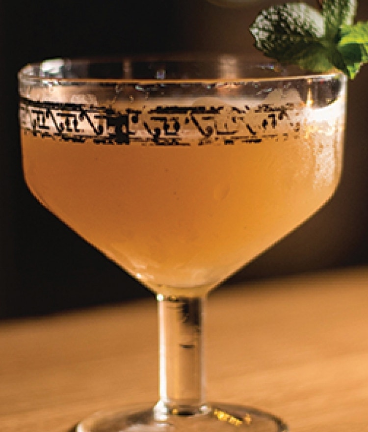 cocktail with green garnish