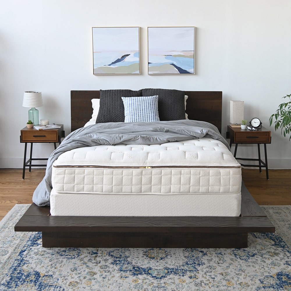 Woman laying in bed with body pillow