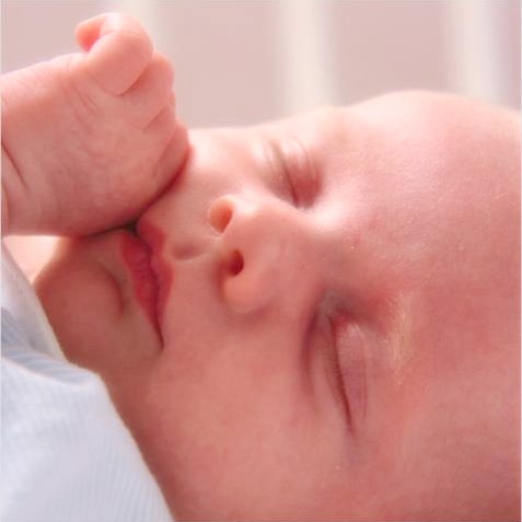 Close-up of sleeping newborn's face