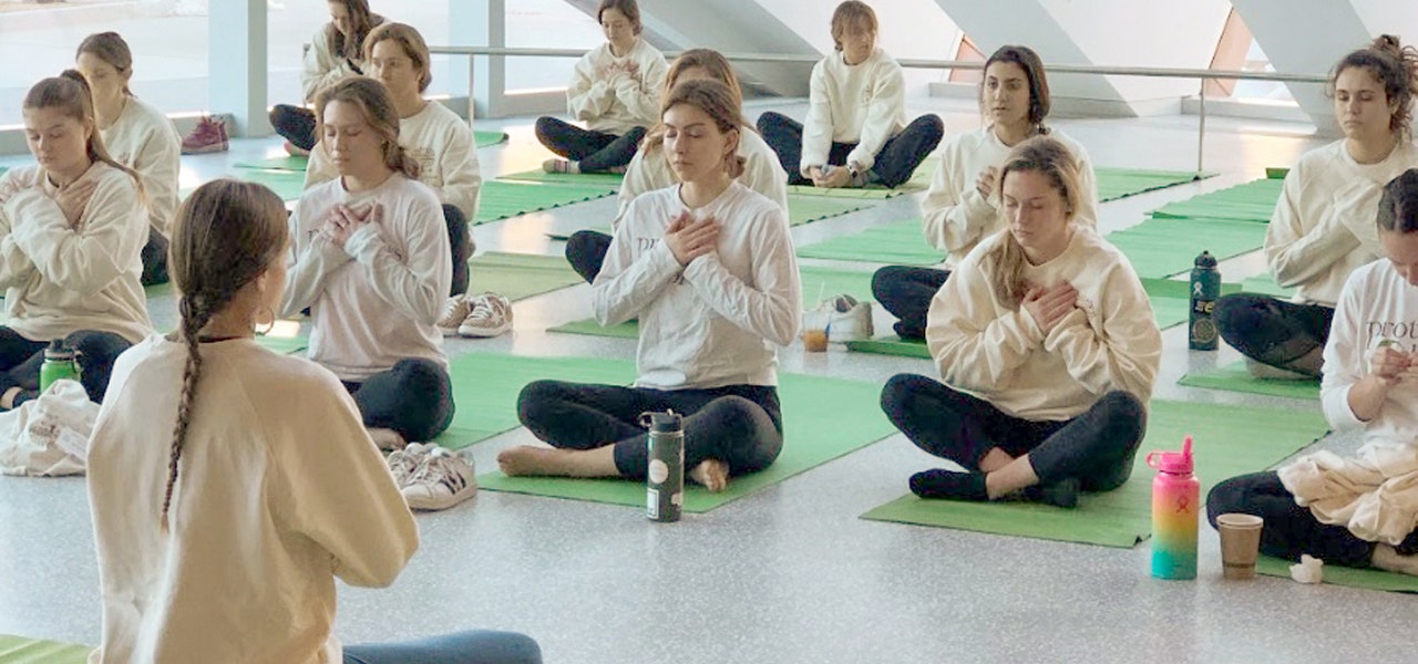 Group of female students in a yoga and meditation class