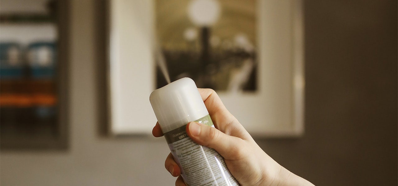 Bottle of aerosal air freshener showing ingredients label