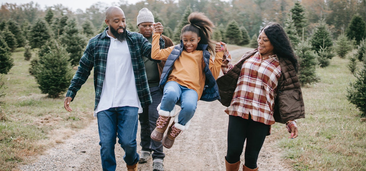 Family of four outdoors enjoying a hike in honor of CEH Day