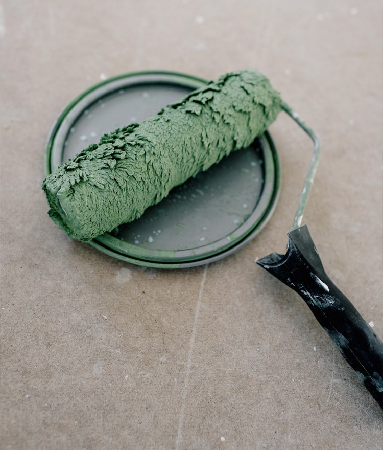 Paint roller with green, lead-based paint