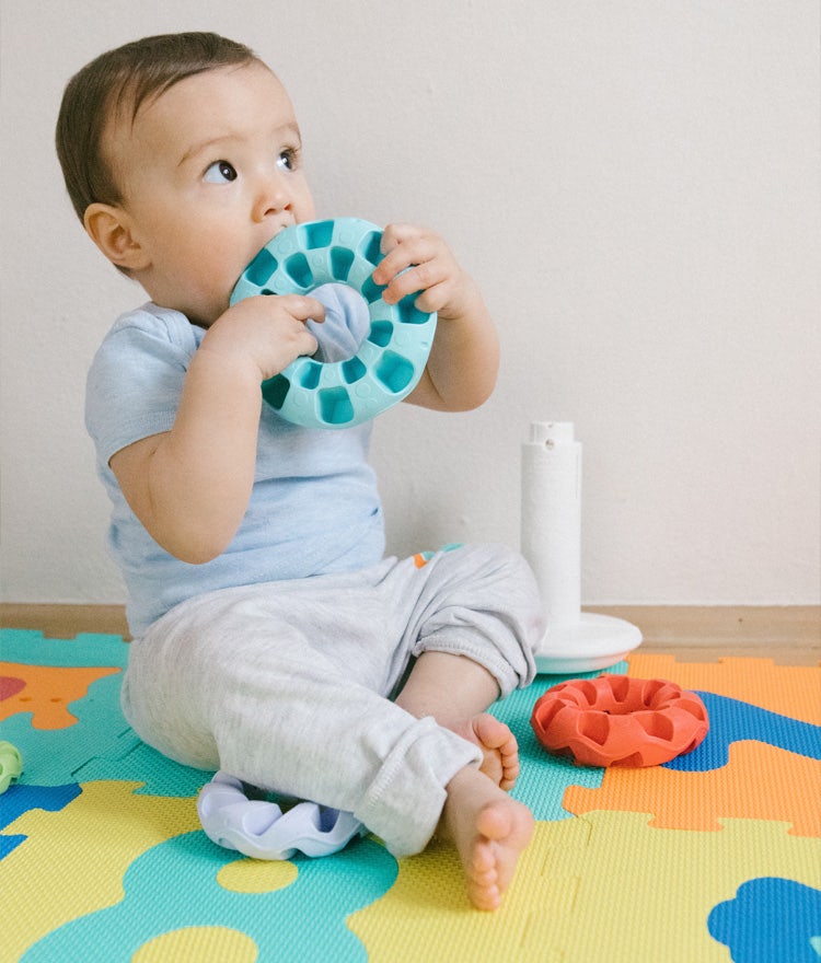 Baby chewing on a plastic toy that may contain harmful phthalates