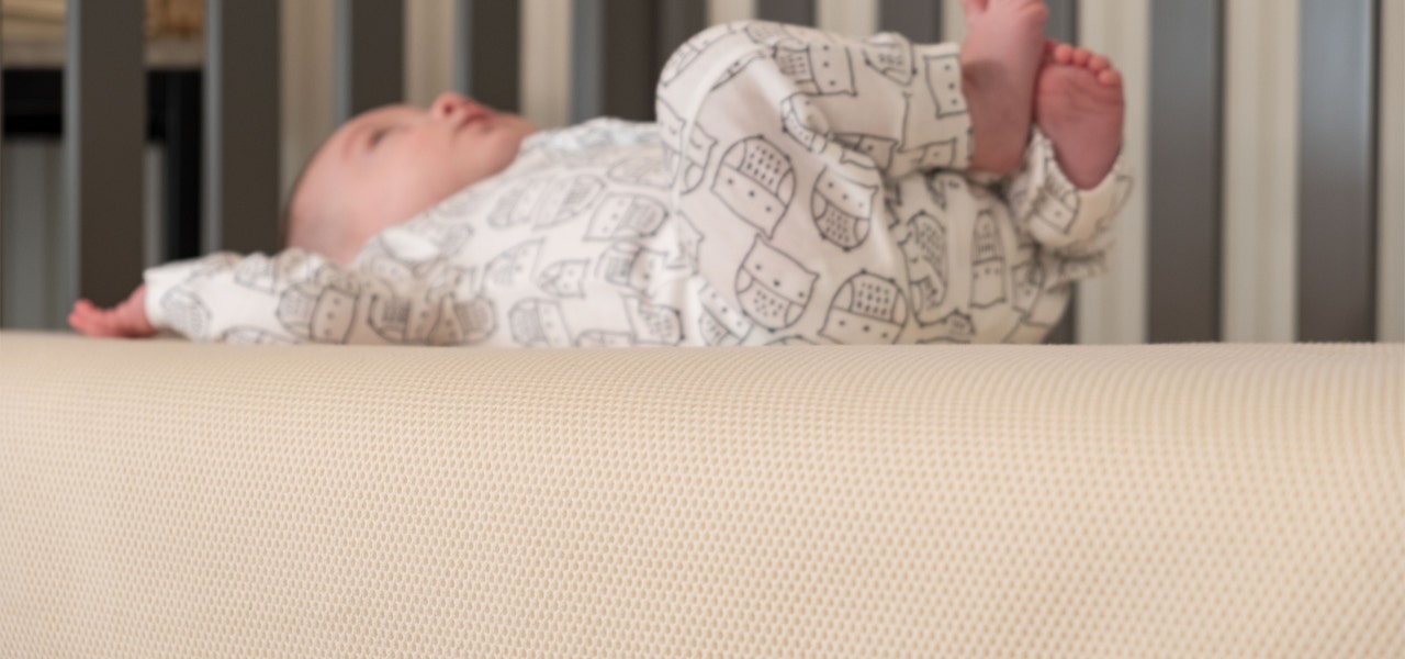 Infant lying on a breathable organic mattress 