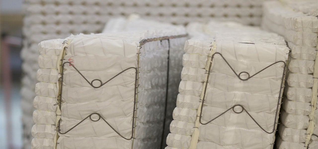 Conventional mattress coil systems made with formaldehyde