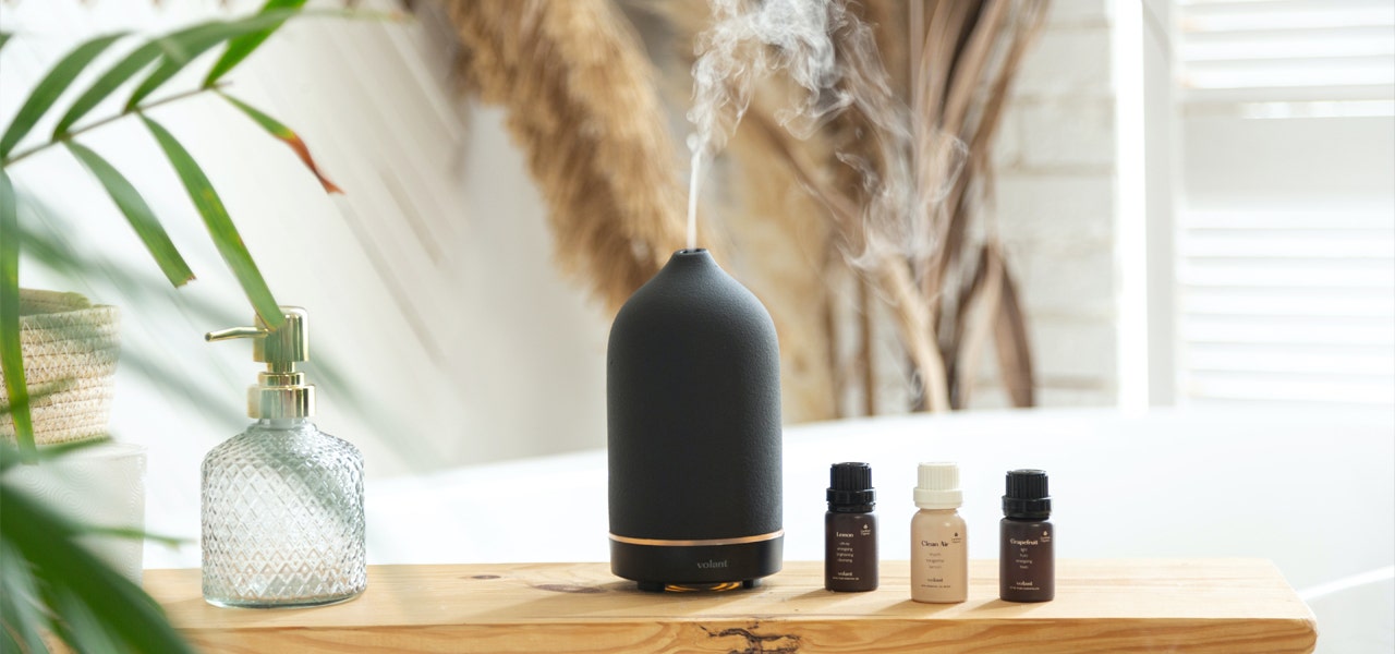 Black essenital oil diffuser in a clean, bright room