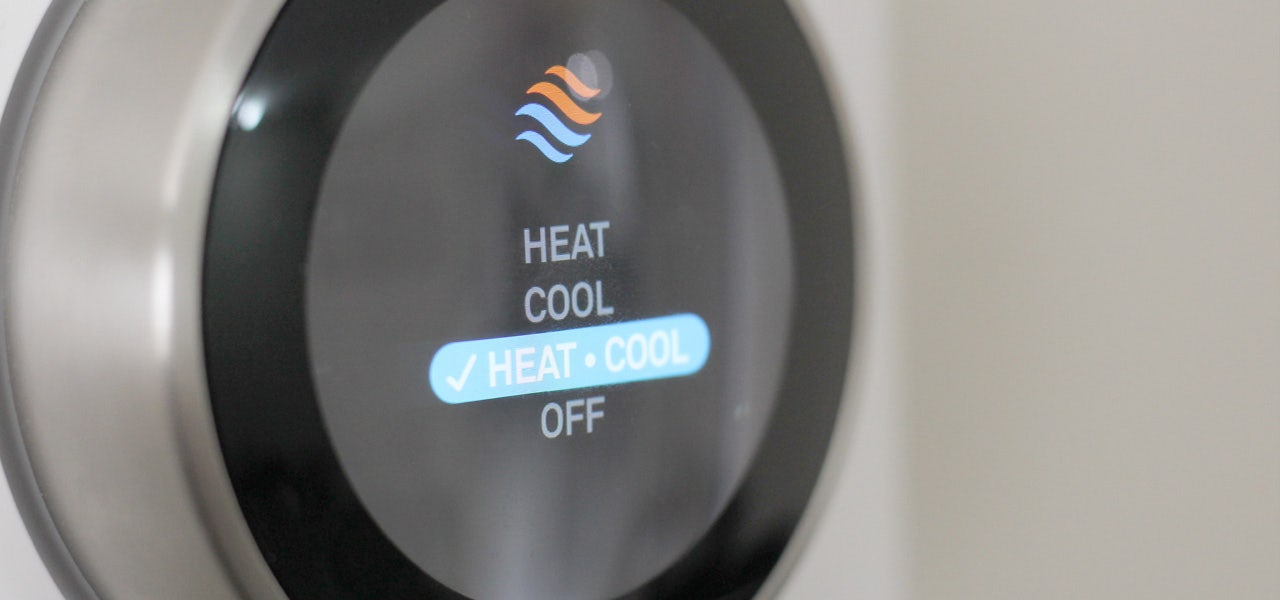 Digital thermostat showing settings