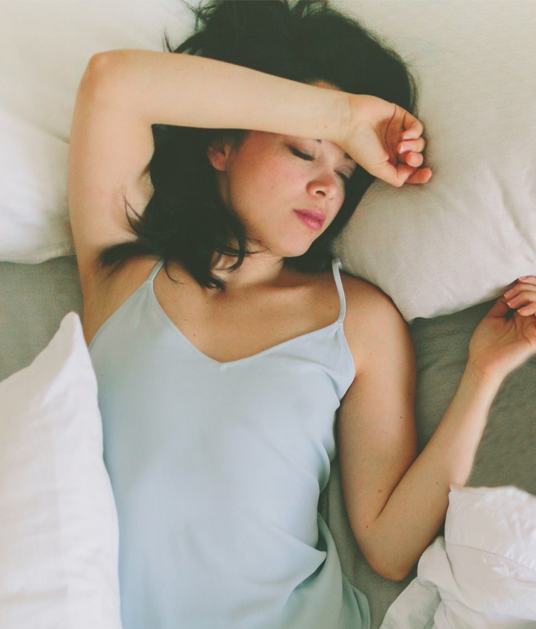 Woman sleeping cool and comfy in a tank top 