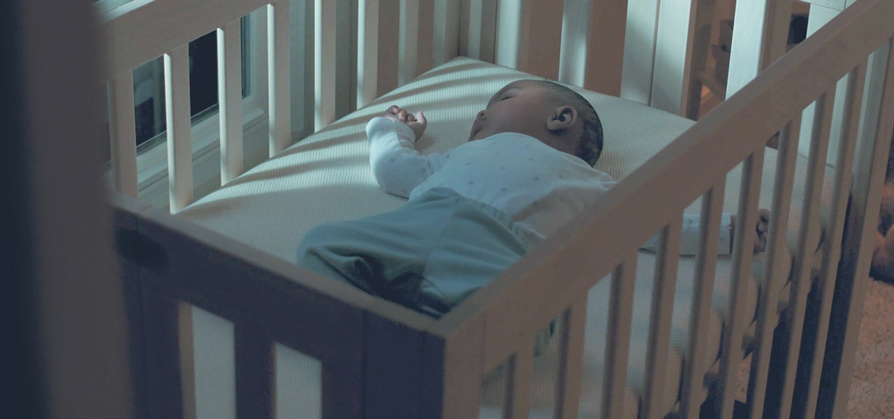 Baby sleeping soundly in their crib at night