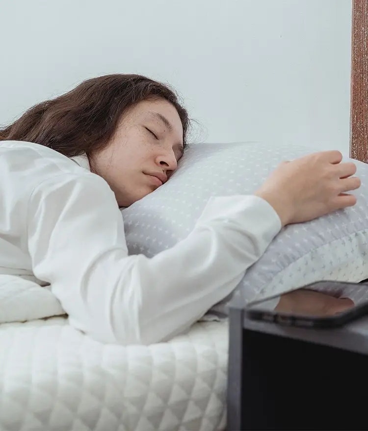Woman sleeping on an organic mattress