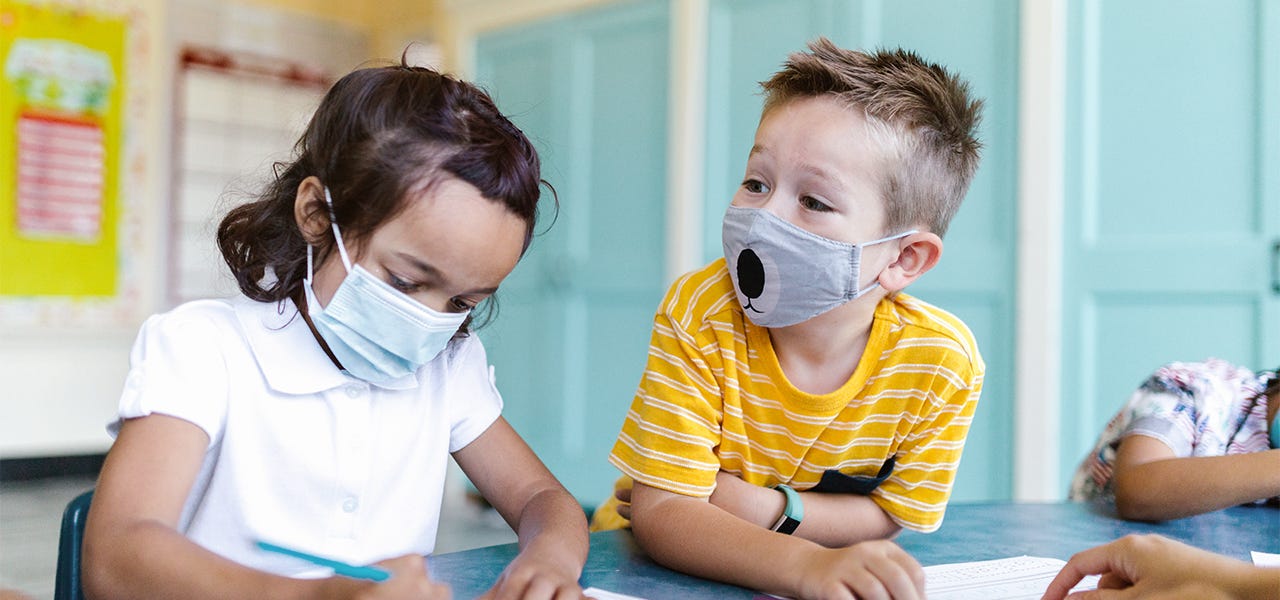 Children masking at school to stop the spread of viruses