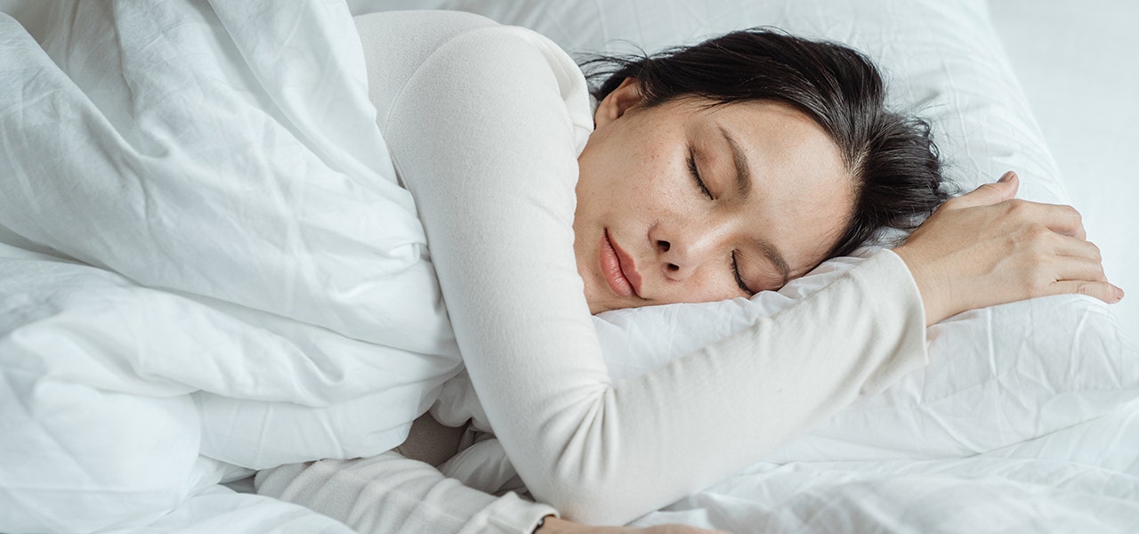 Woman sleeping soundly on a pocketed coil mattress