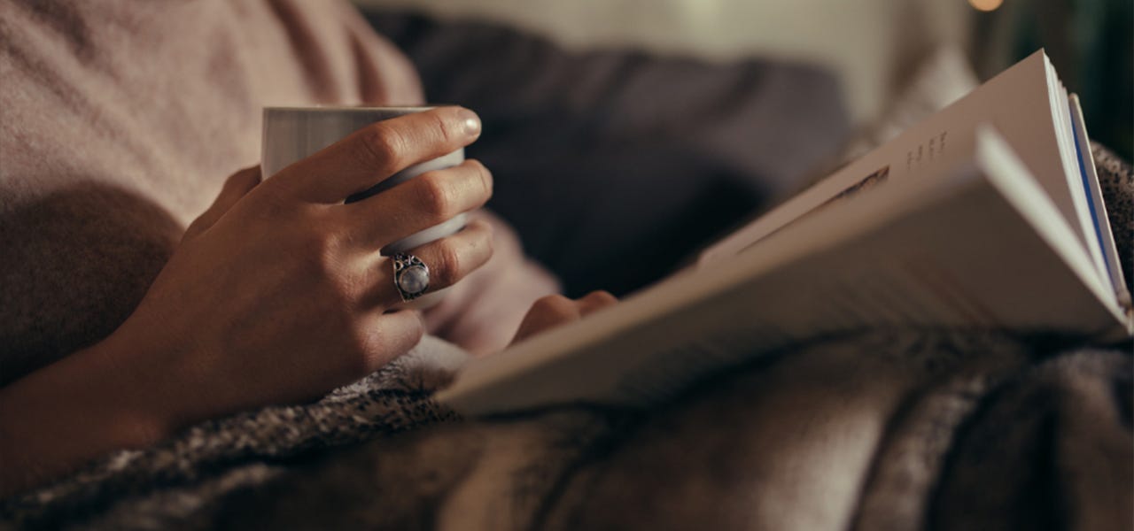 drinking tea and reading a book