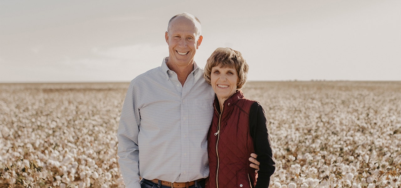 husband and wife in an organic cotton field