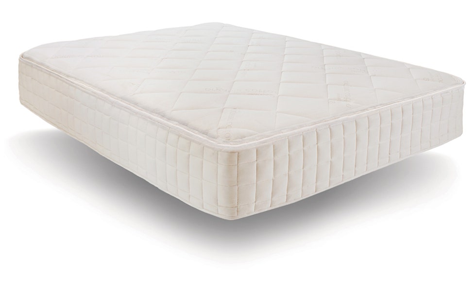 Angled shot of mattress on white background