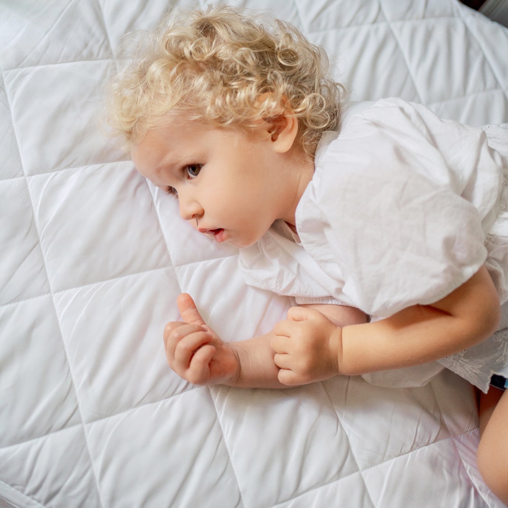 Toddler on Quilted Cover