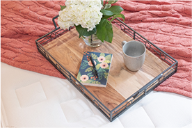 Tray with Notepad, Coffee Mug and Flower on Mattress